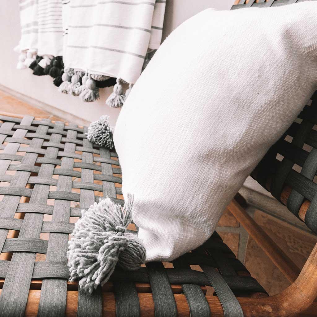 POKOLOKO Solid Moroccan Pom Pom Pillow - 20x20 #color_light-grey-pom