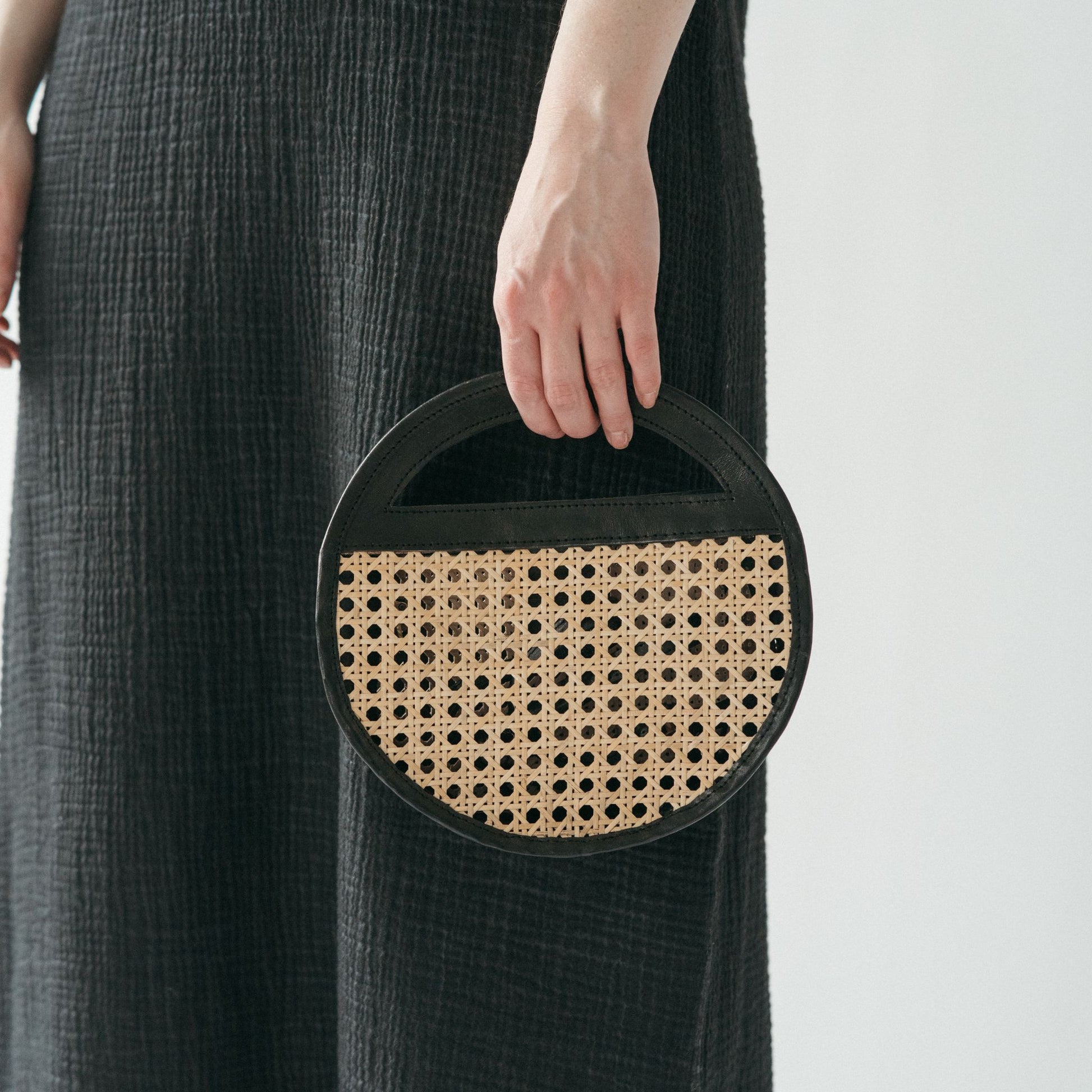 POKOLOKO Round Leather Bag with Cane Accent #color_black